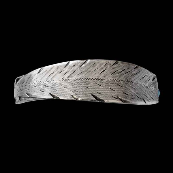 The Willie Western Cuff Bracelet is a truly unique cuff bracelet feautring a 3D feather motif, silver beads and a custom stone on the outer part of the jewelry piece. Free your spirit and order it now!